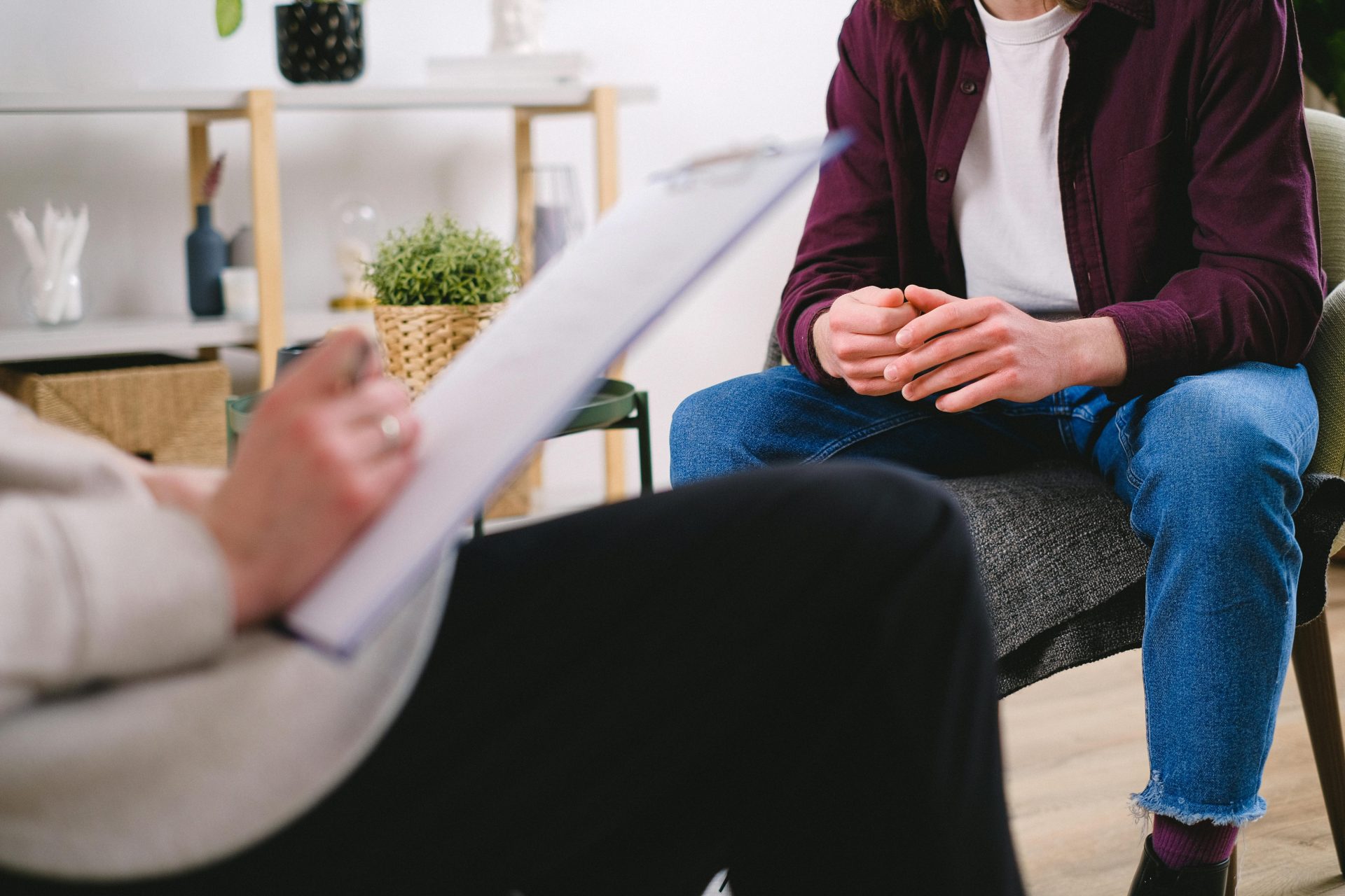 Therapist and client discussing issues in a psychotherapy session, highlighting mental health support.